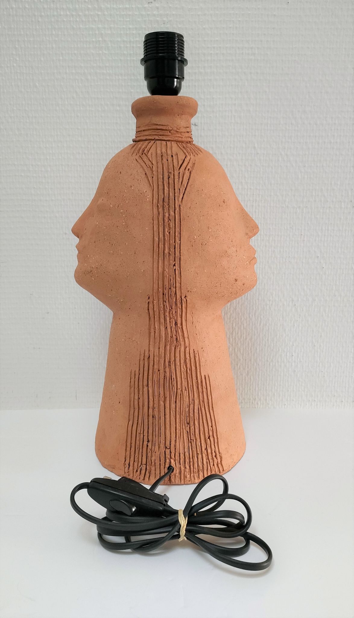 Anthropomorphic lamp foot depicting two faces terracotta design 80s