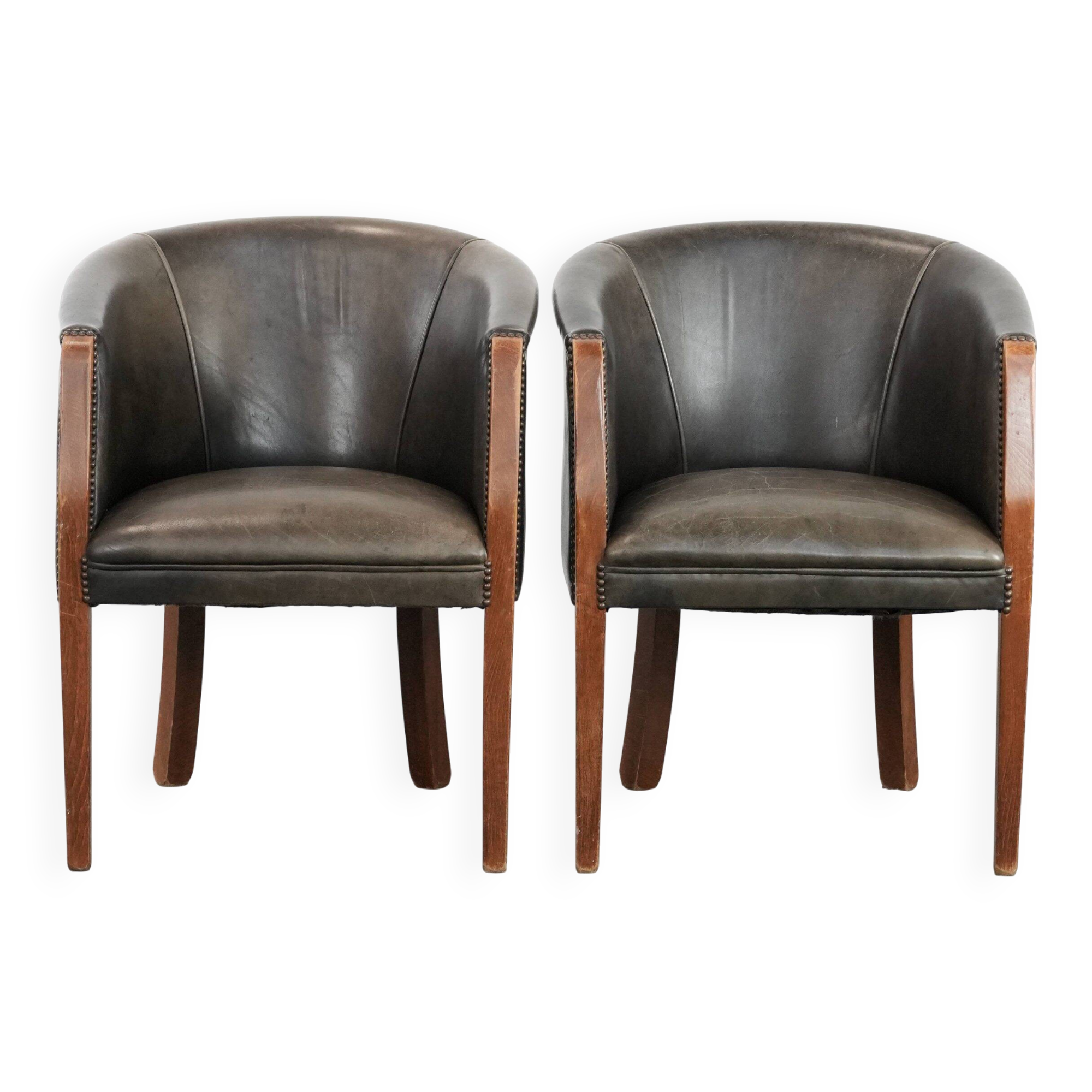 Set of two cowhide and wooden tub chairs with a sturdy colour scheme