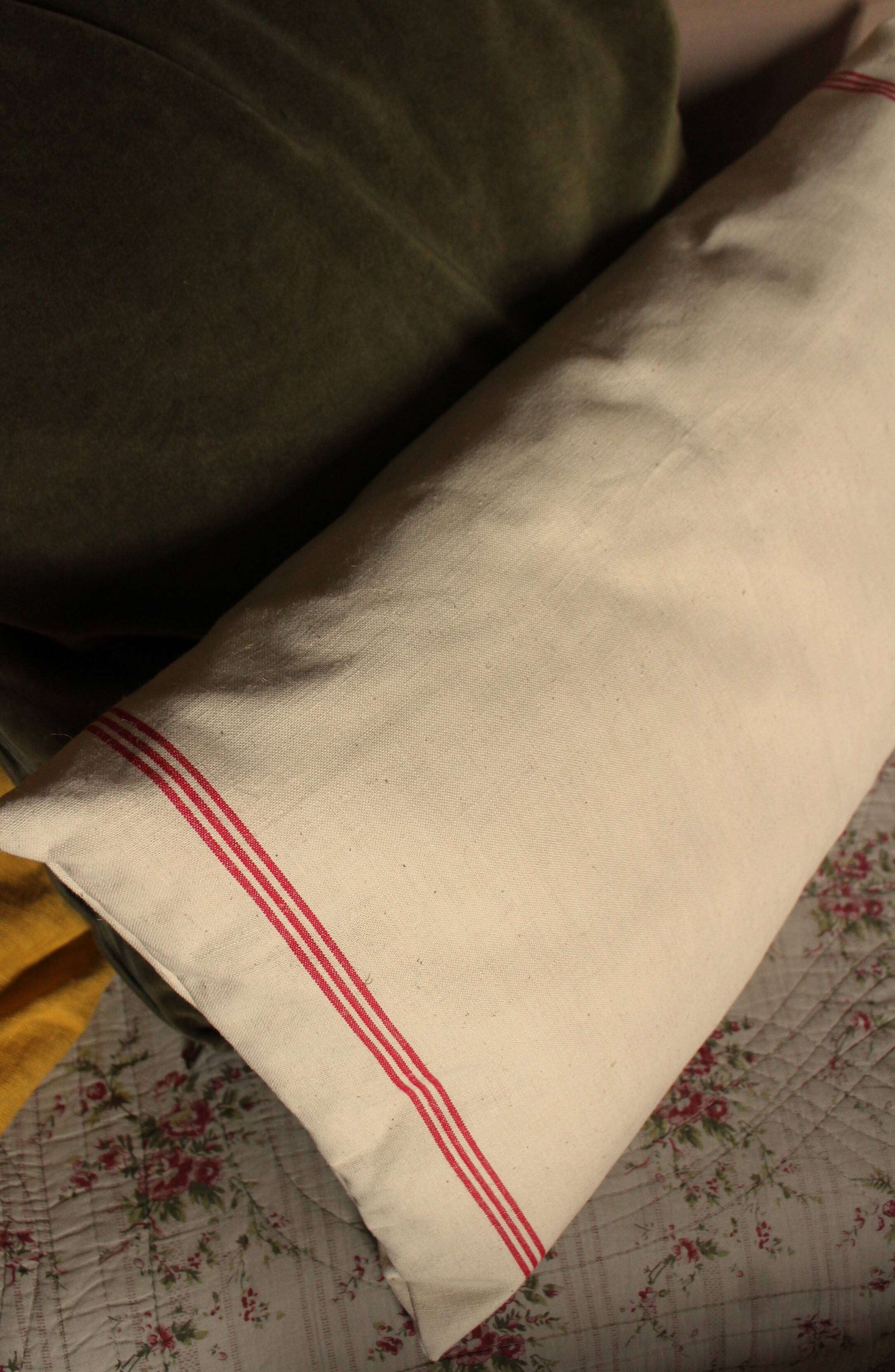 Old red striped Torchon cushion