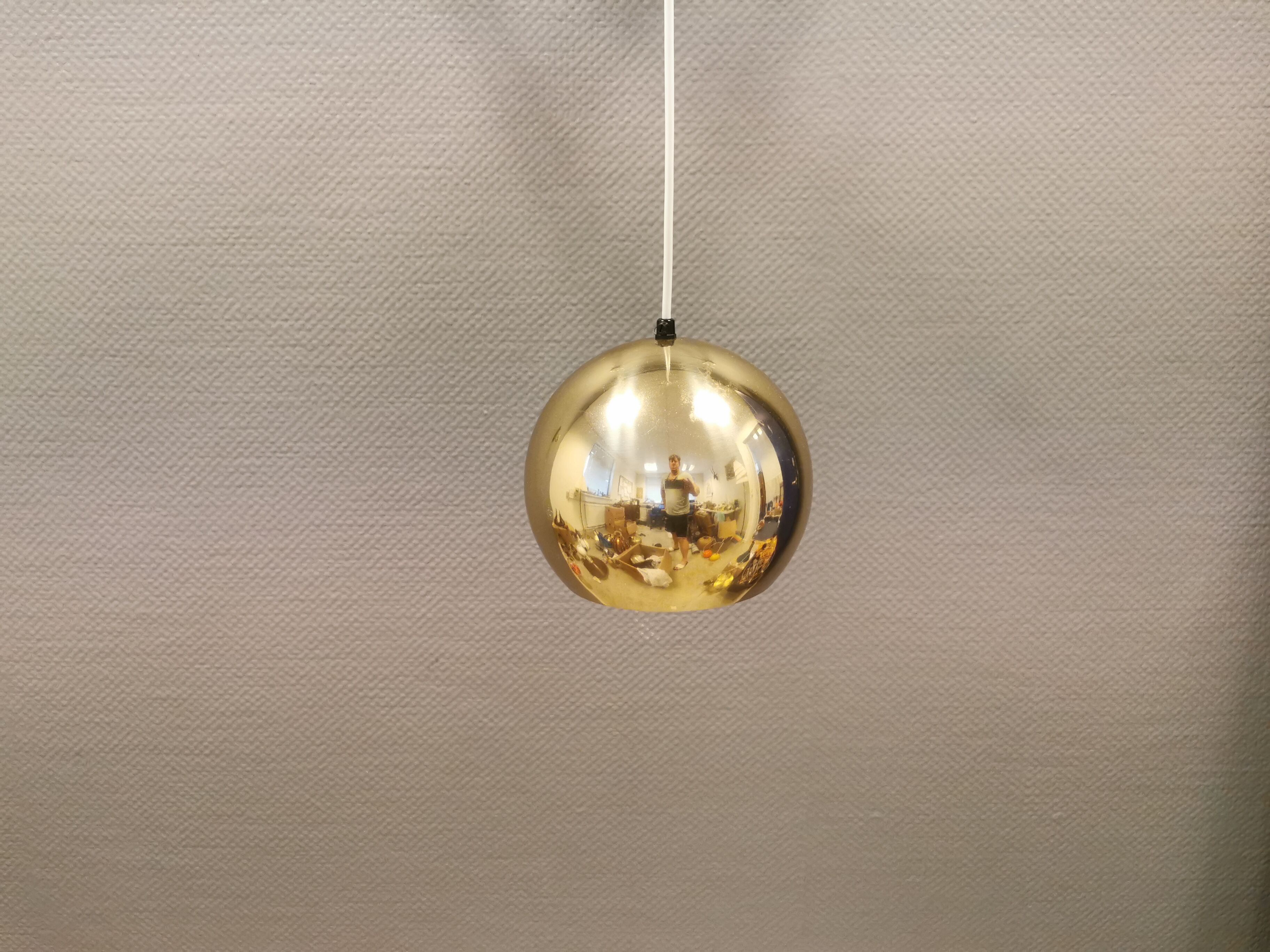 Danish ball lamp from the 80s, in gold colored lacquer.