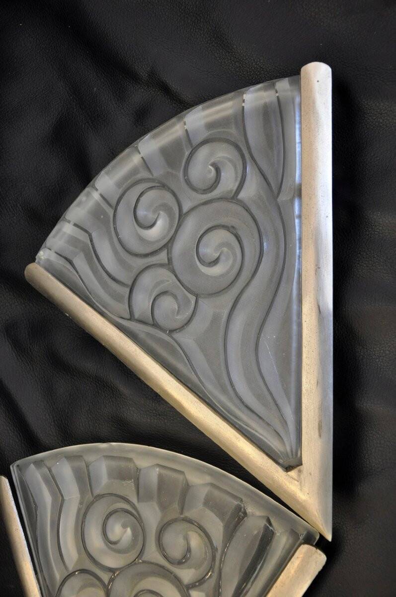 Pair of angular art deco wall sconces with silver metal frames