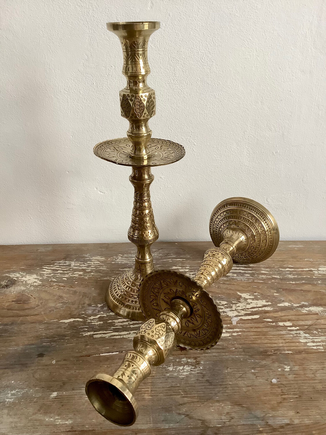 Pair of engraved brass candle holders