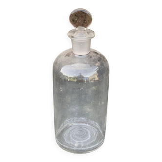 Bottle, old transparent glass bottle in transparent glass, drop-shaped cap