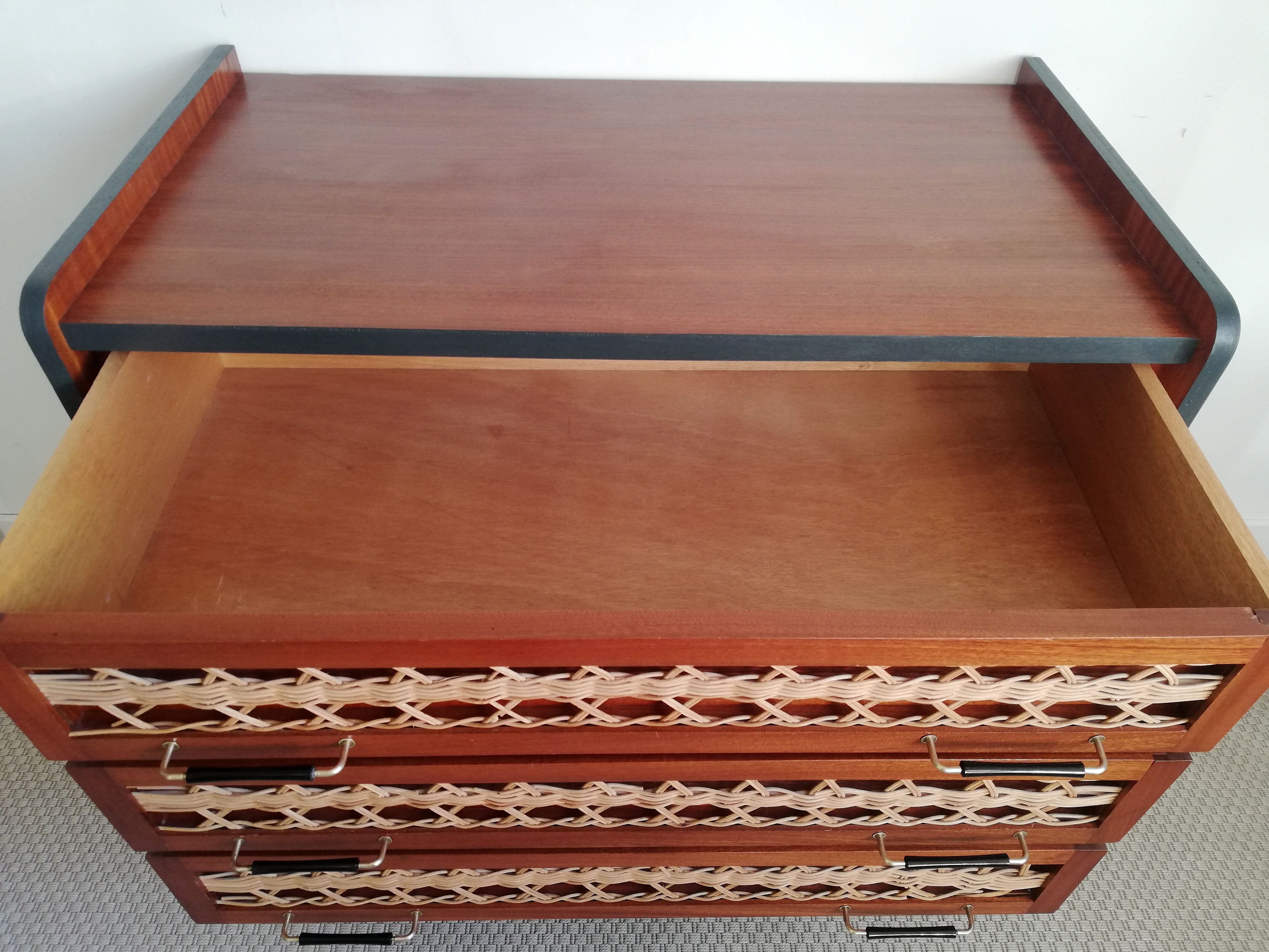 Teak and rattan chest of drawers feet compass