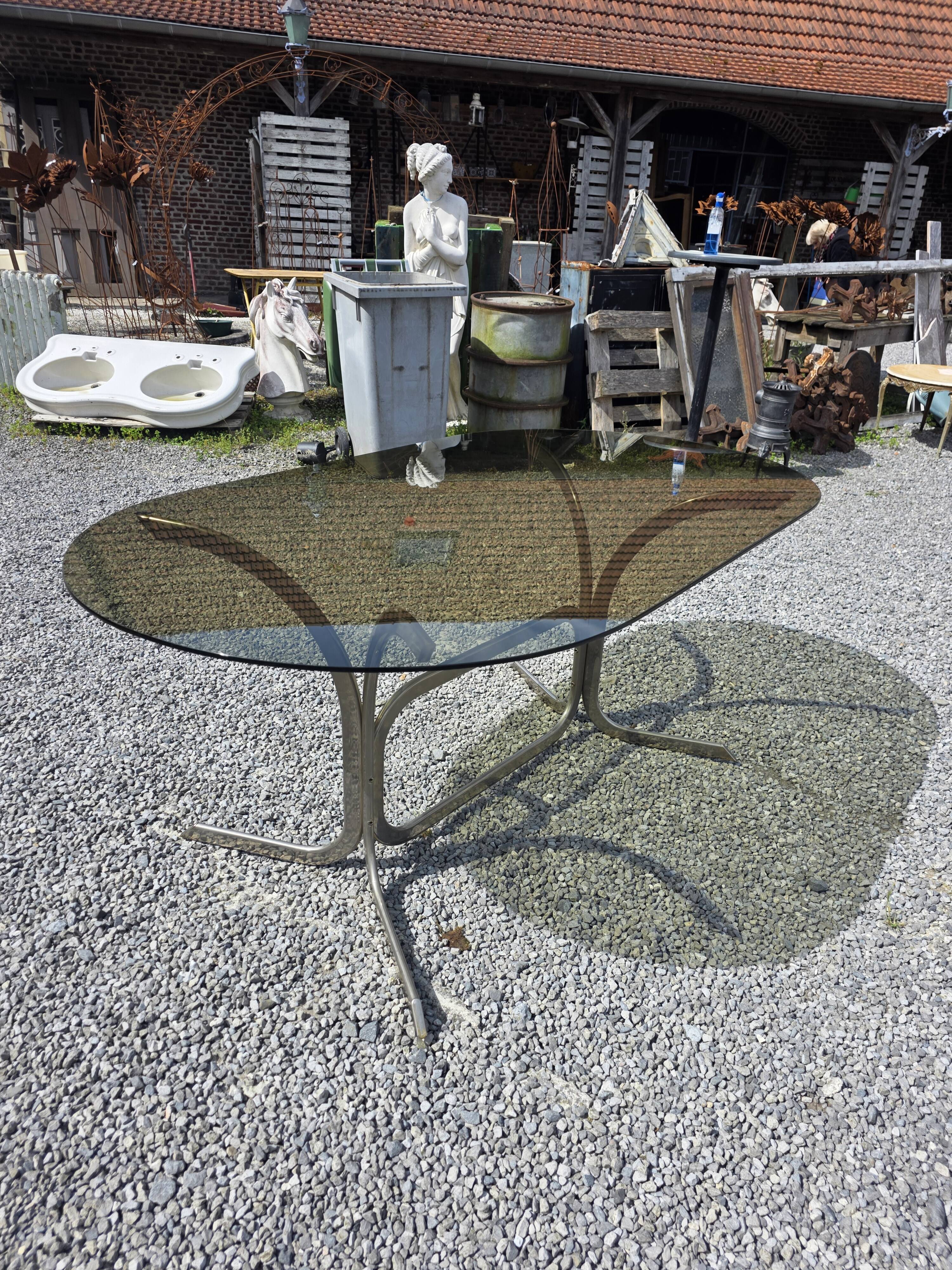 Silver metal table with smoked glass top from the 1970s.