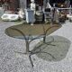 Silver metal table with smoked glass top from the 1970s.