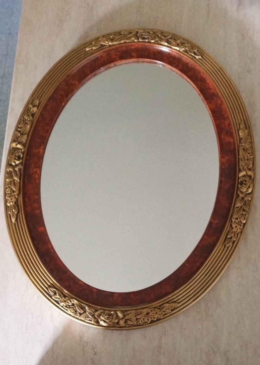 Modern oval mirror with flower decoration
