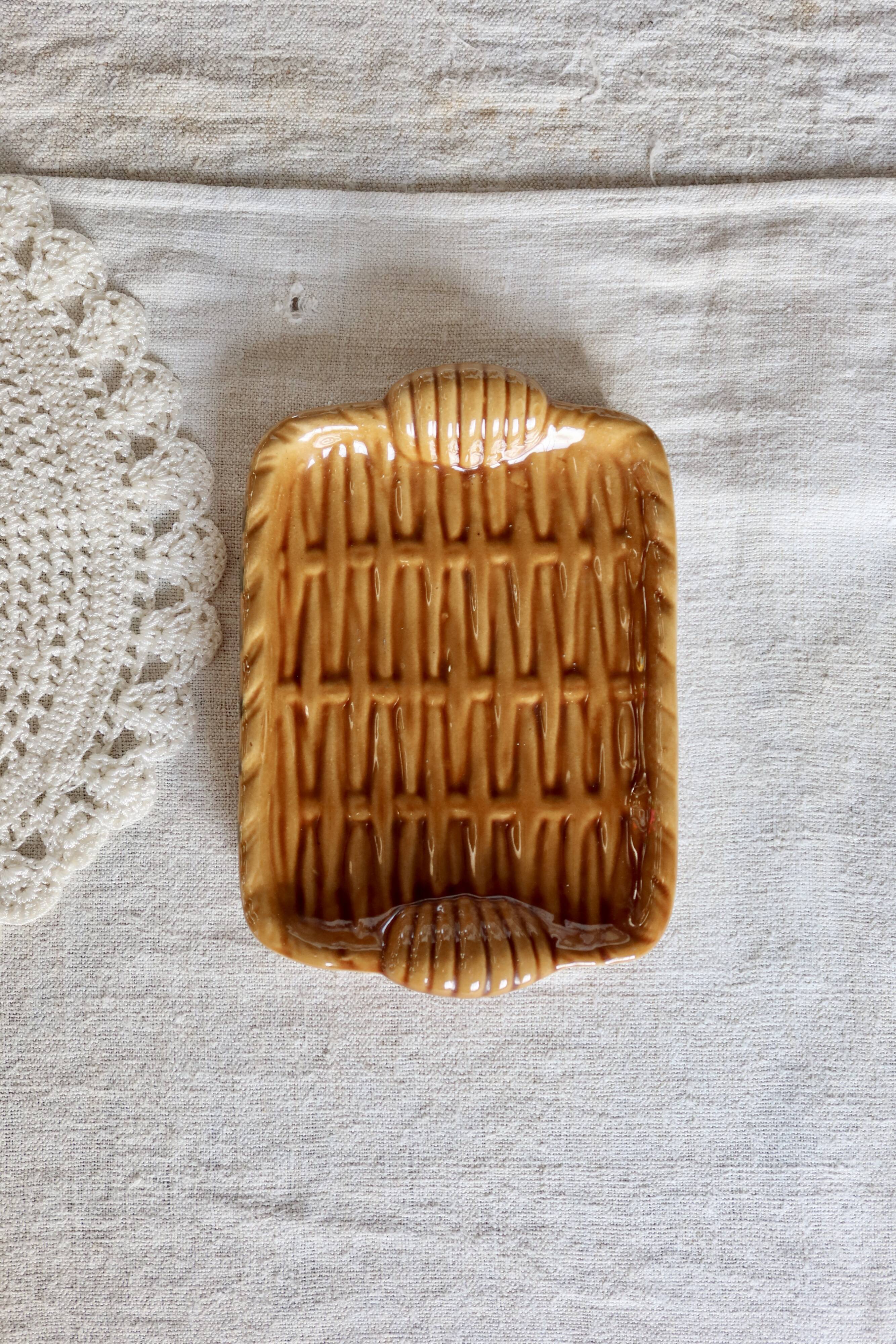 Vintage ceramic trinket dish in mustard color with a braided effect