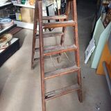 Old wooden stepladder shelf decoration