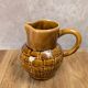 Vintage Sarreguemines pitcher with brown relief decoration.