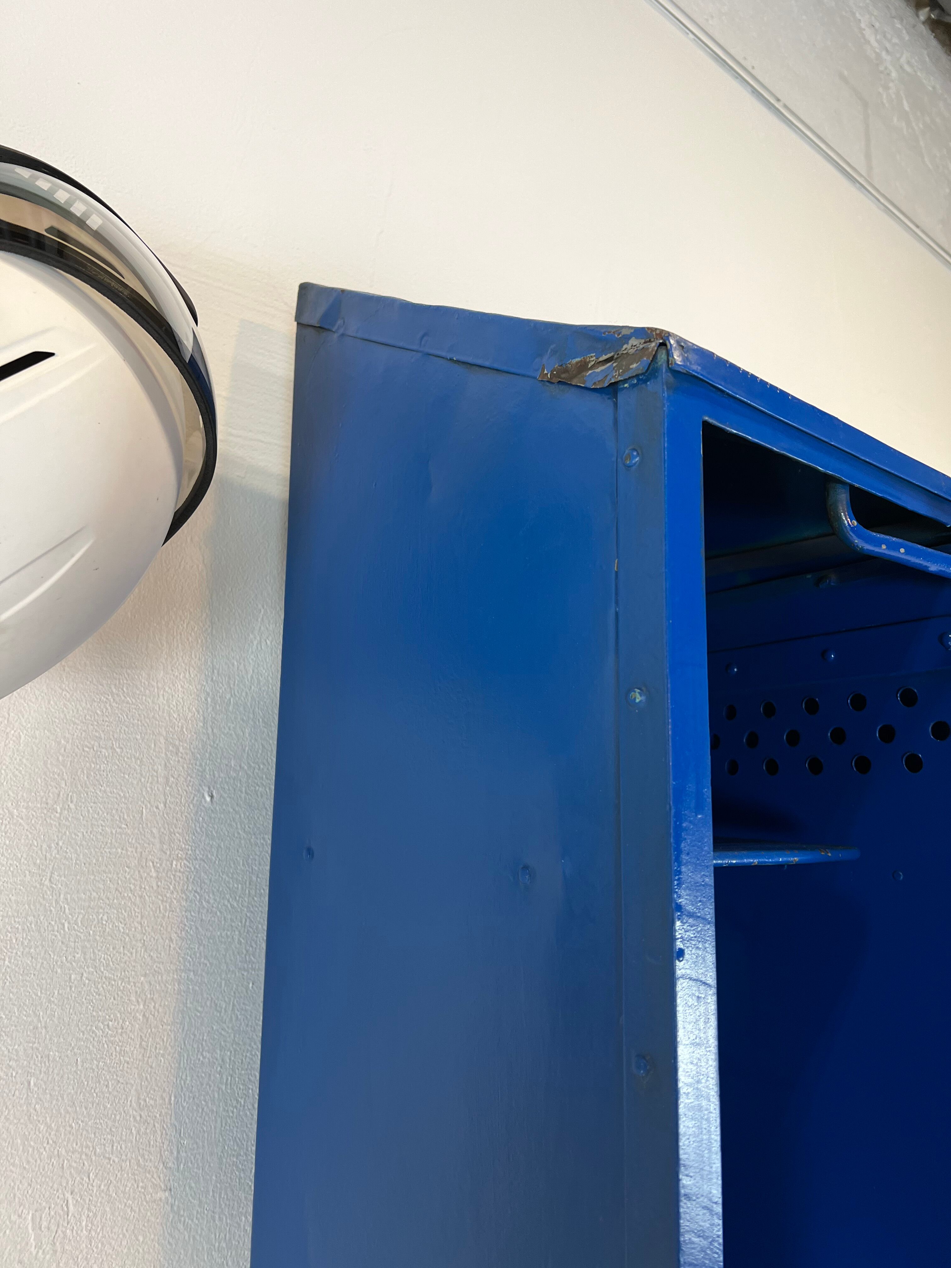 Metal locker with metal rivets