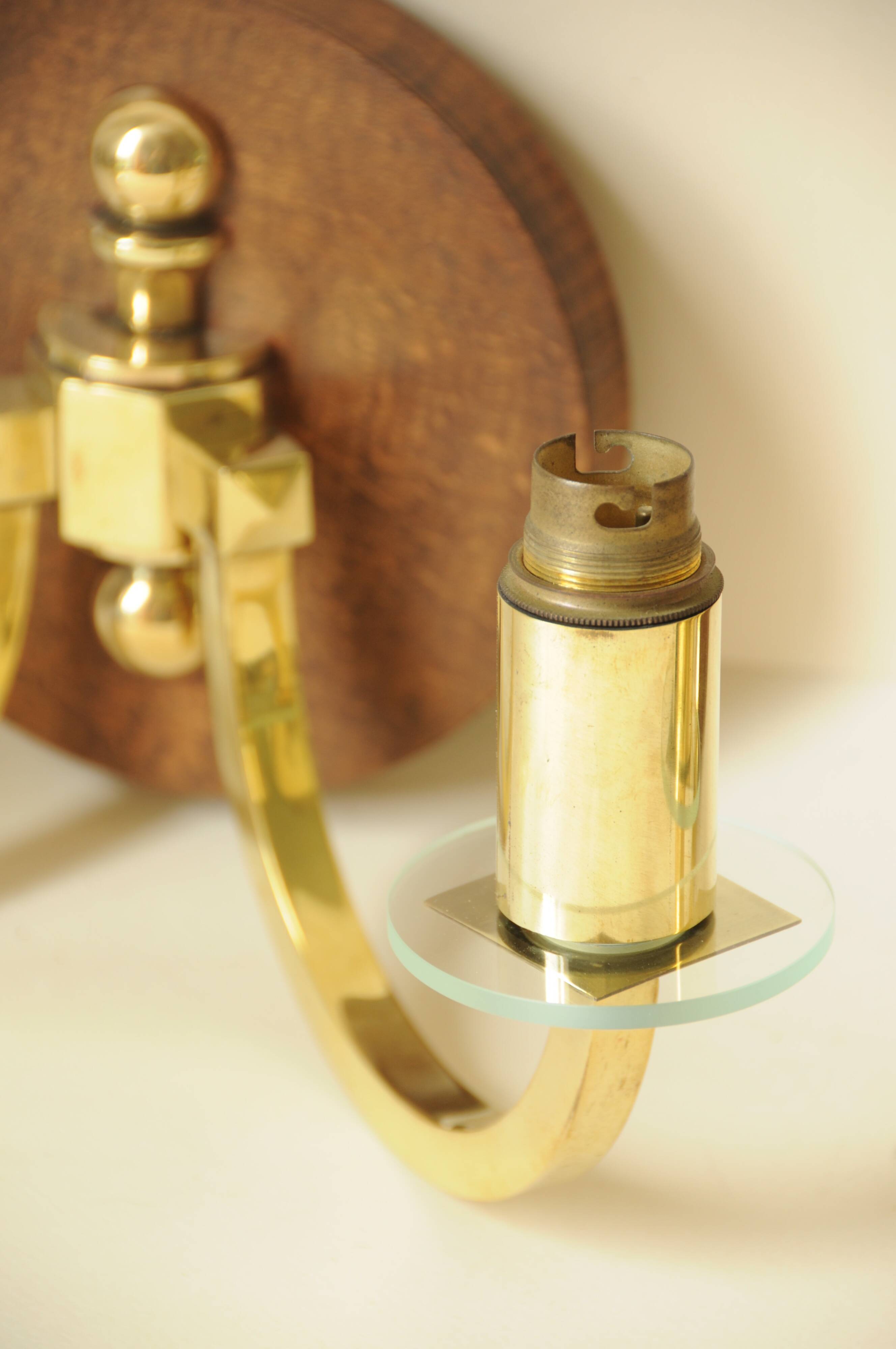 Pair of vintage wall sconces in polished gold brass, wood and glass