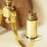Pair of vintage wall sconces in polished gold brass, wood and glass