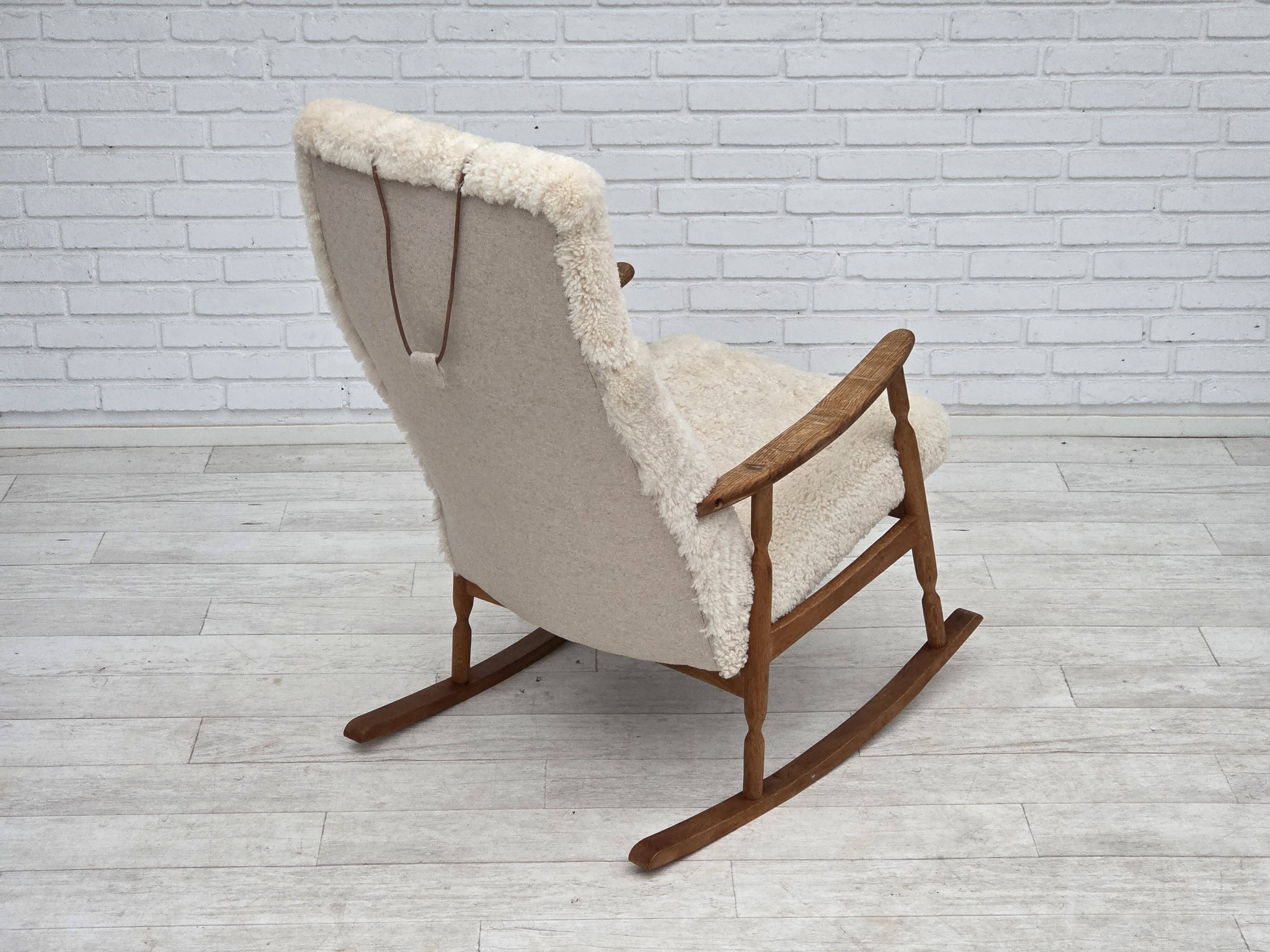 1970s, Danish rocking chair, reupholstered in quality genuine sheepskin.