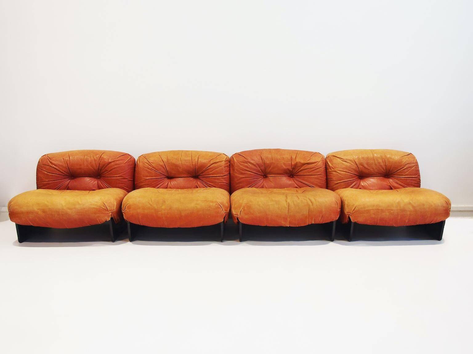 Set of four modular sun loungers by Giuseppe Munari upholstered in cognac leather.