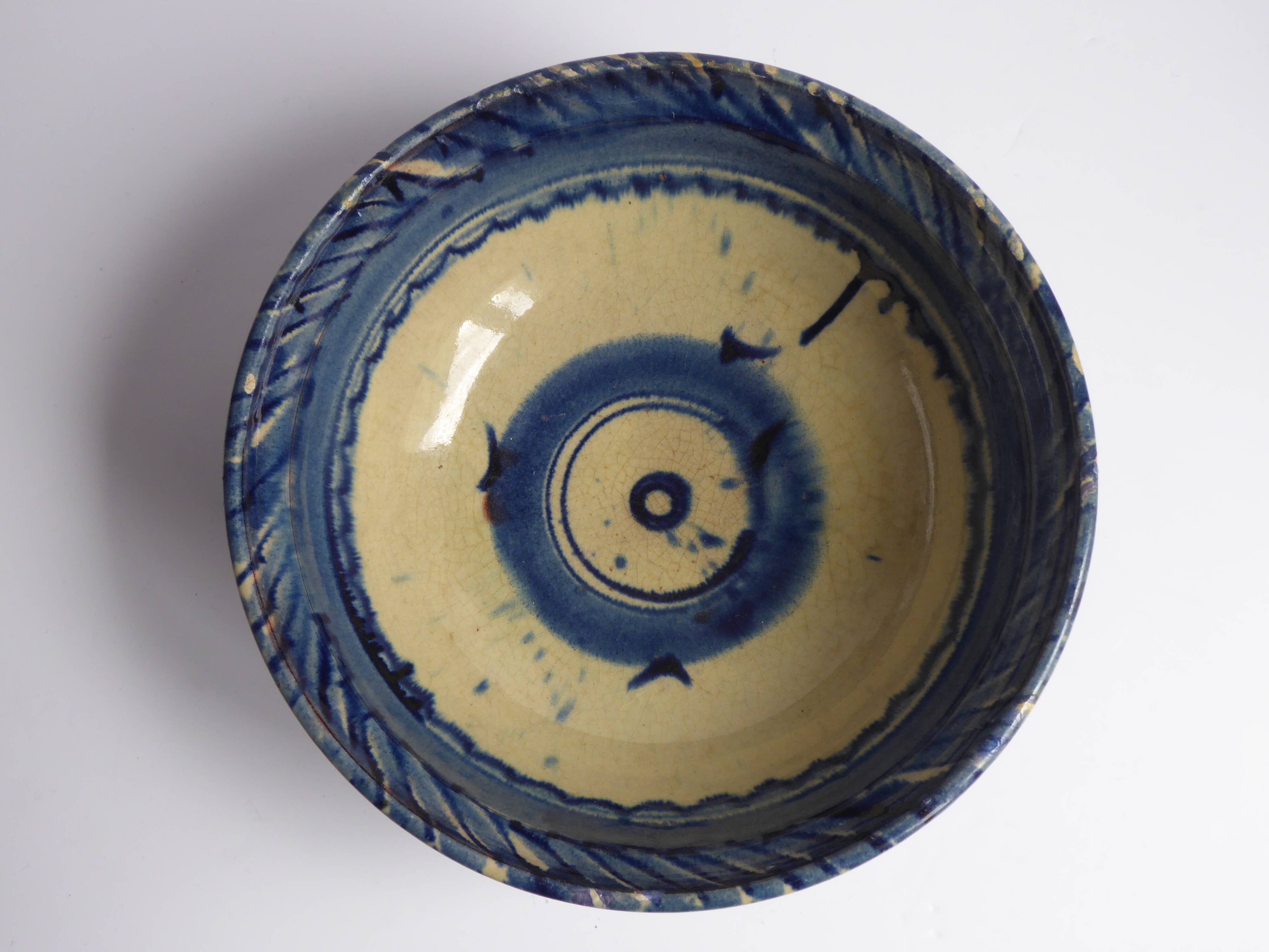 Blue enamelled terracotta cup