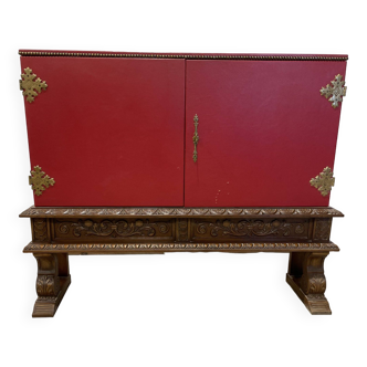 Bar cabinet with carved red skai studded wood base
