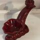 Ruby red ceramic pocket ashtray from Vallauris, numbered.