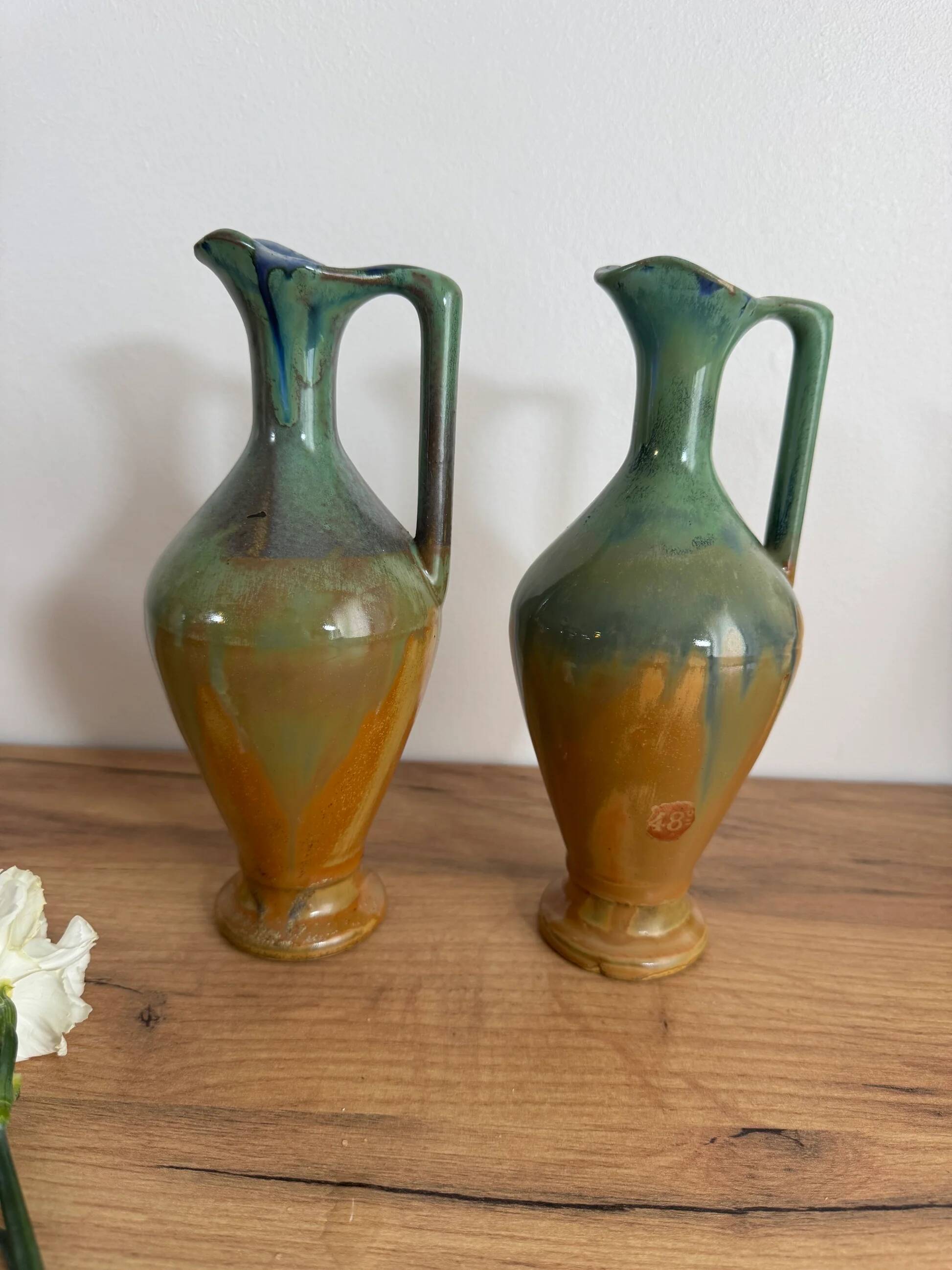 Set of 2 signed ceramic jugs