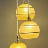 Suspension triple vintage glass globes in frosted yellow and gold.