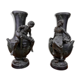 François Moreau: Pair of vases with Napoleon III period characters in regula with bronze patina