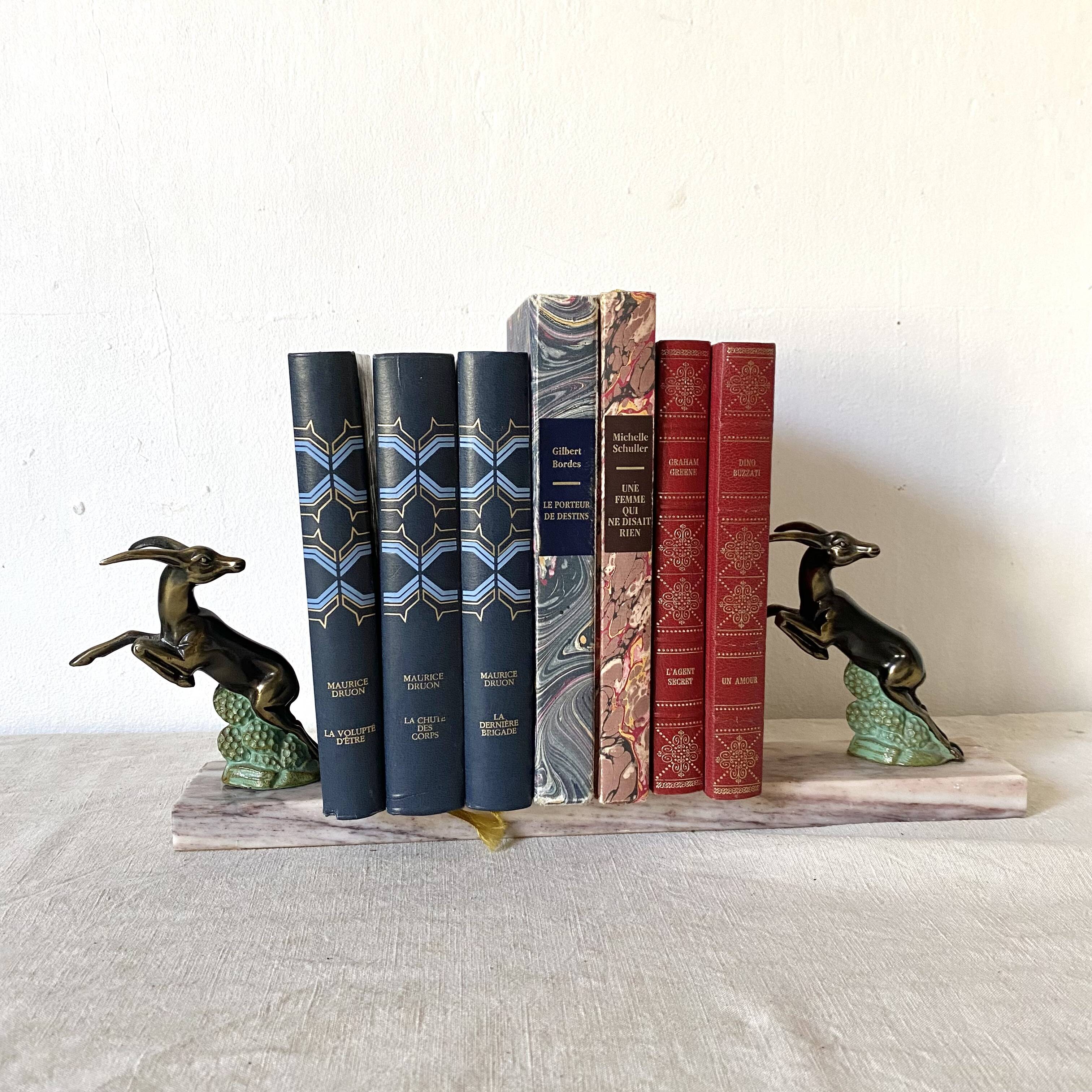 Art deco bookends in pink marble and spelters, antelopes