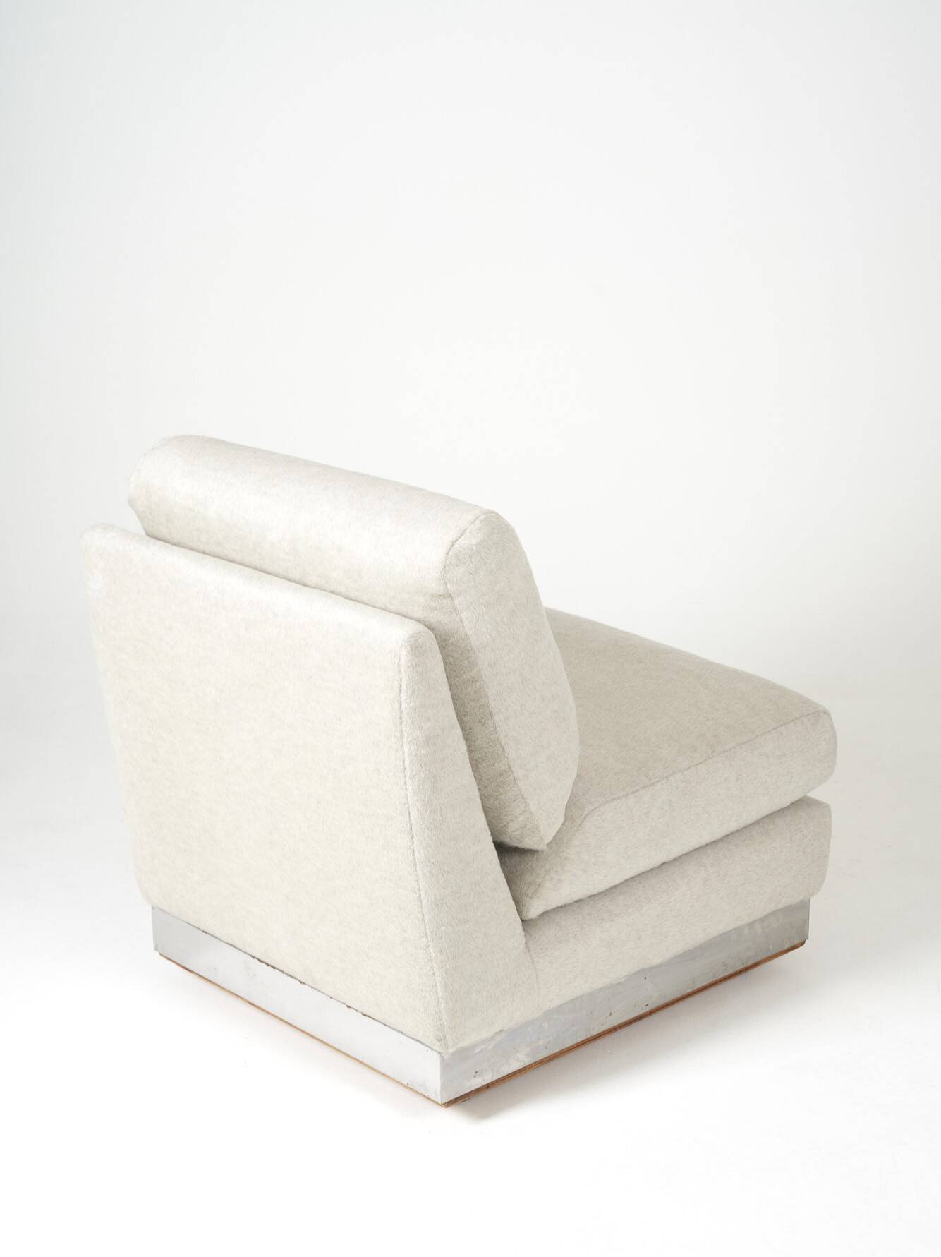 Beige fireside chair by Jacques Charpentier