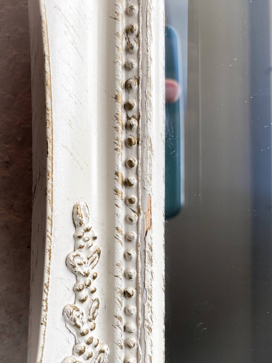 Beveled mirror in carved wood