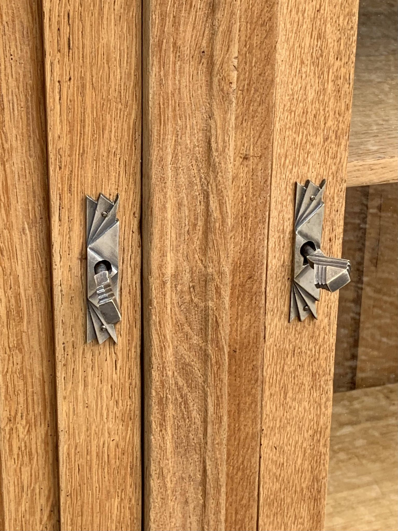 Asymmetrical Art Deco glass-fronted Parisian wardrobe in raw oak, 1930.