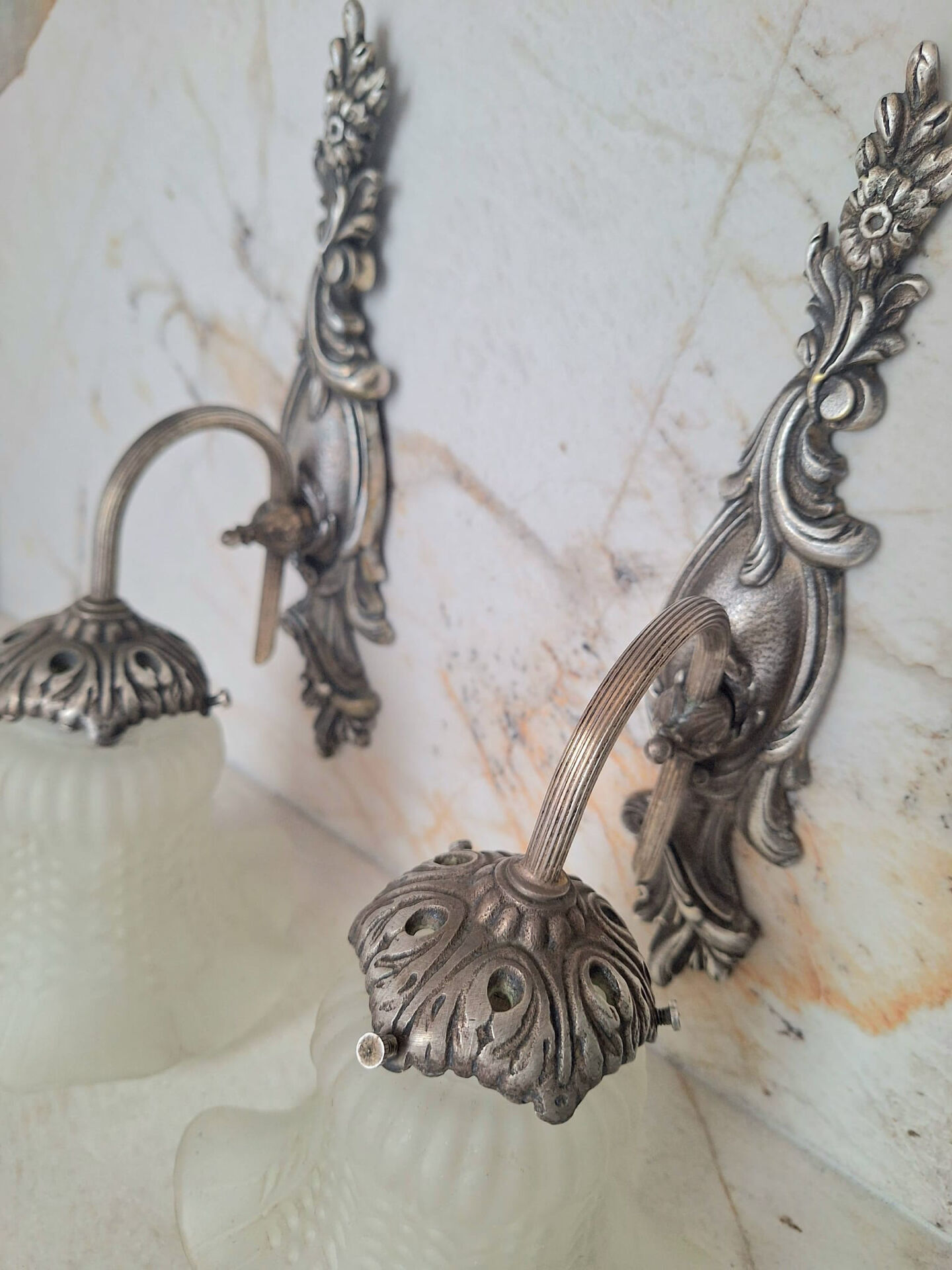 Pairs of Art Deco wall lights, antique fixtures.
