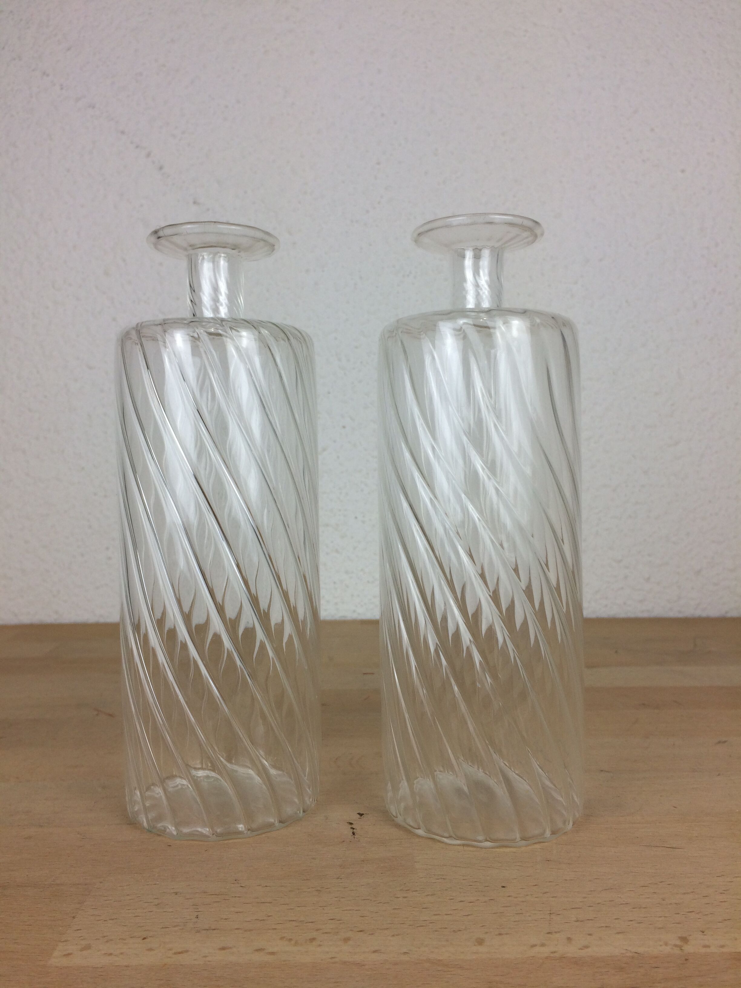Pair of twisted glass bathroom bottle bottles