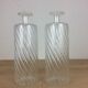 Pair of twisted glass bathroom bottle bottles