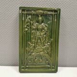 Antique tile in green faience, motif of Saint George and the dragon