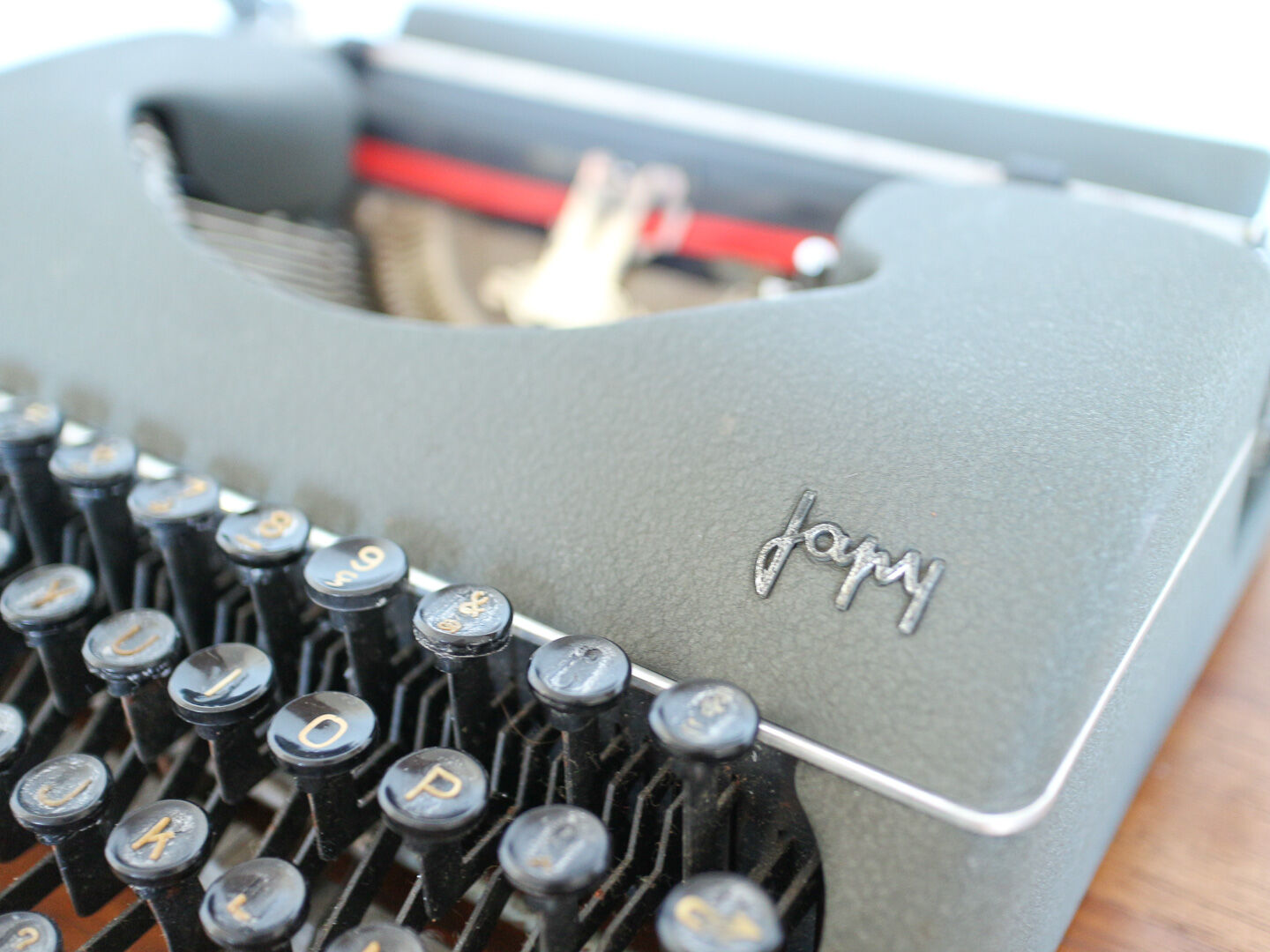 Japy grey-green typewriter with crate
