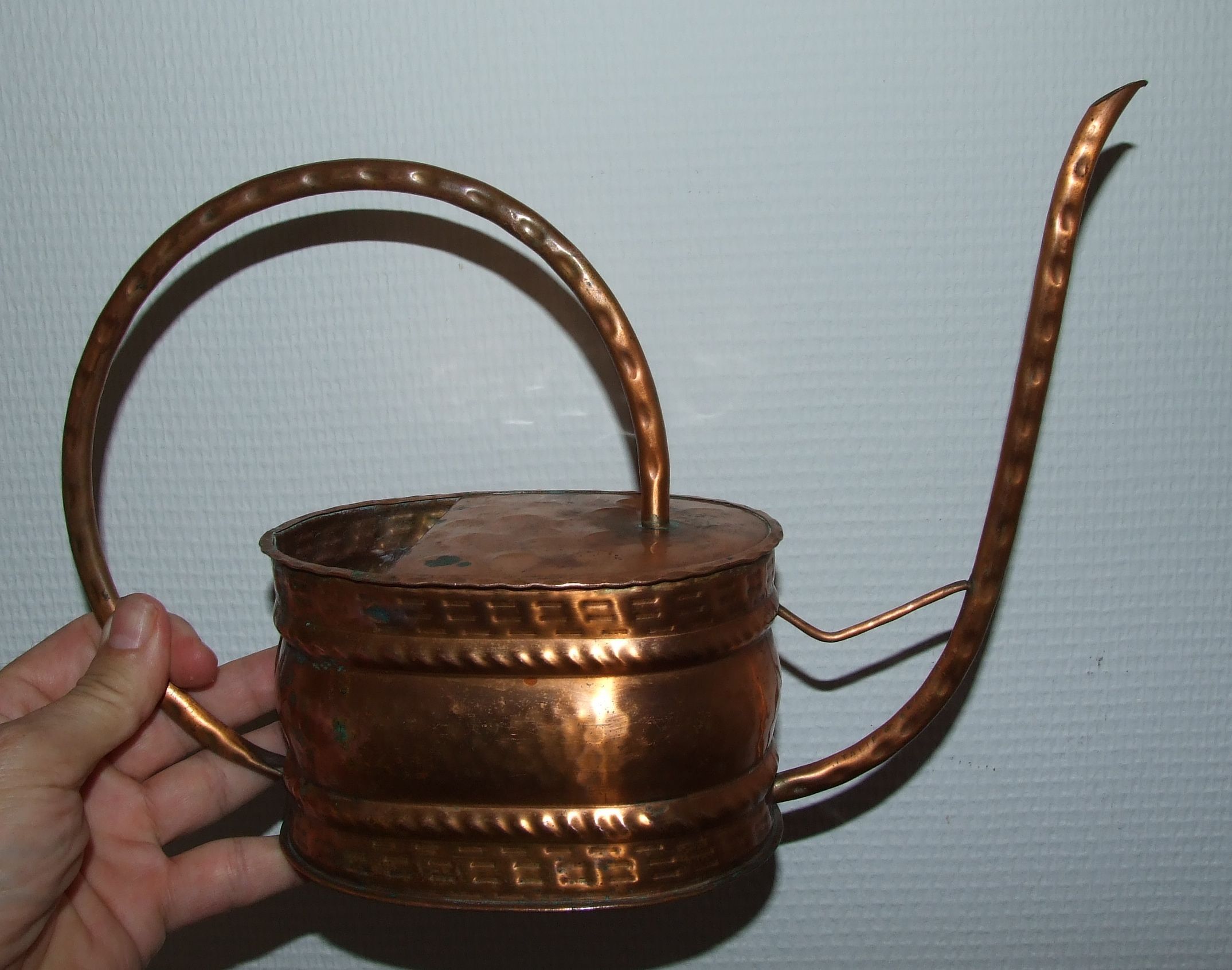 Old copper watering can