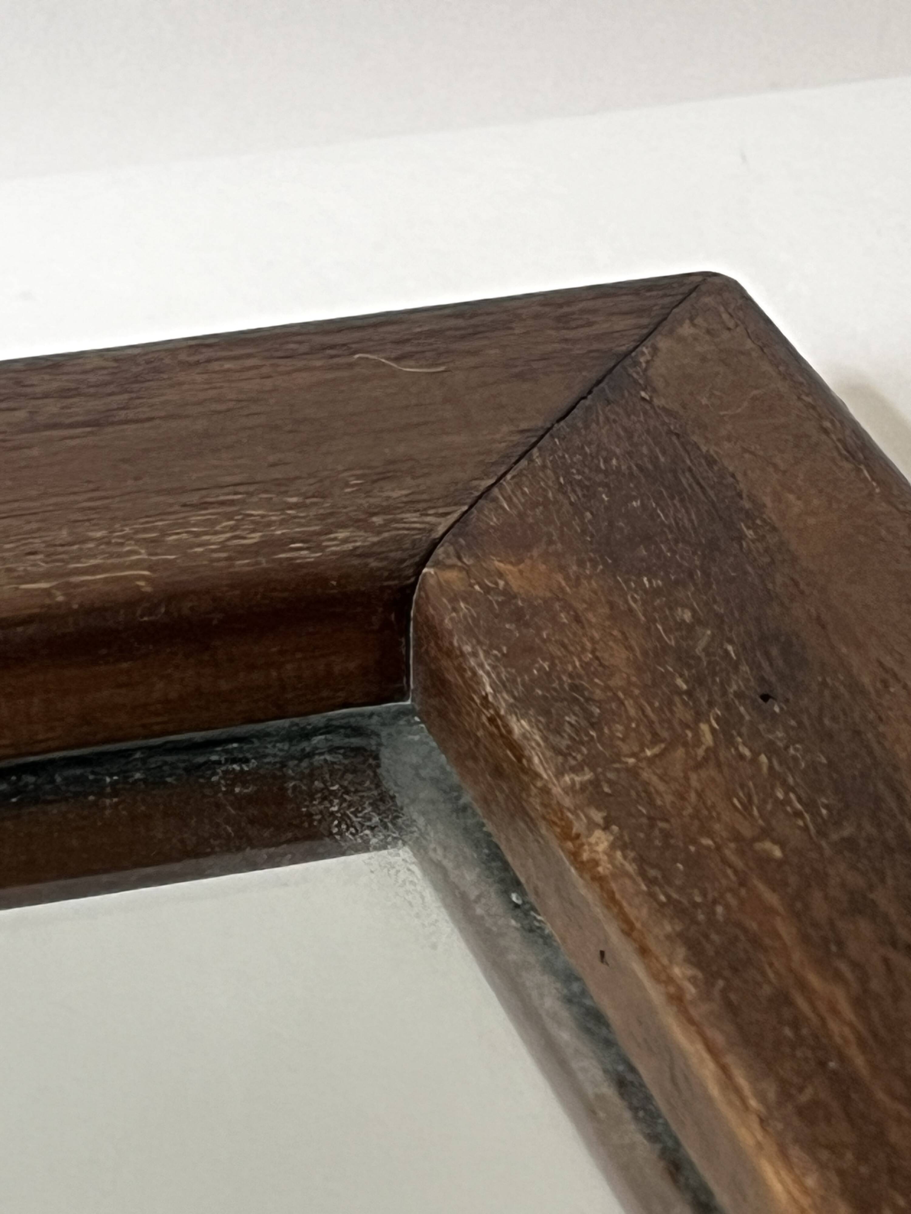 Brutalist rectangular wall mirror in solid wood, France 1950.