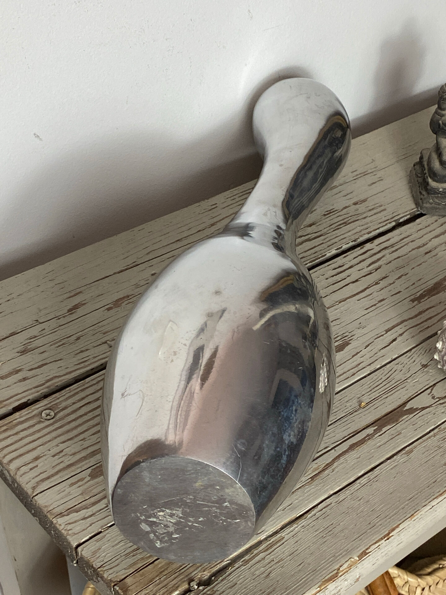 Large organic vase in polished aluminium cast.
