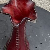Burgundy red blown glass vase in the shape of a vintage corolla