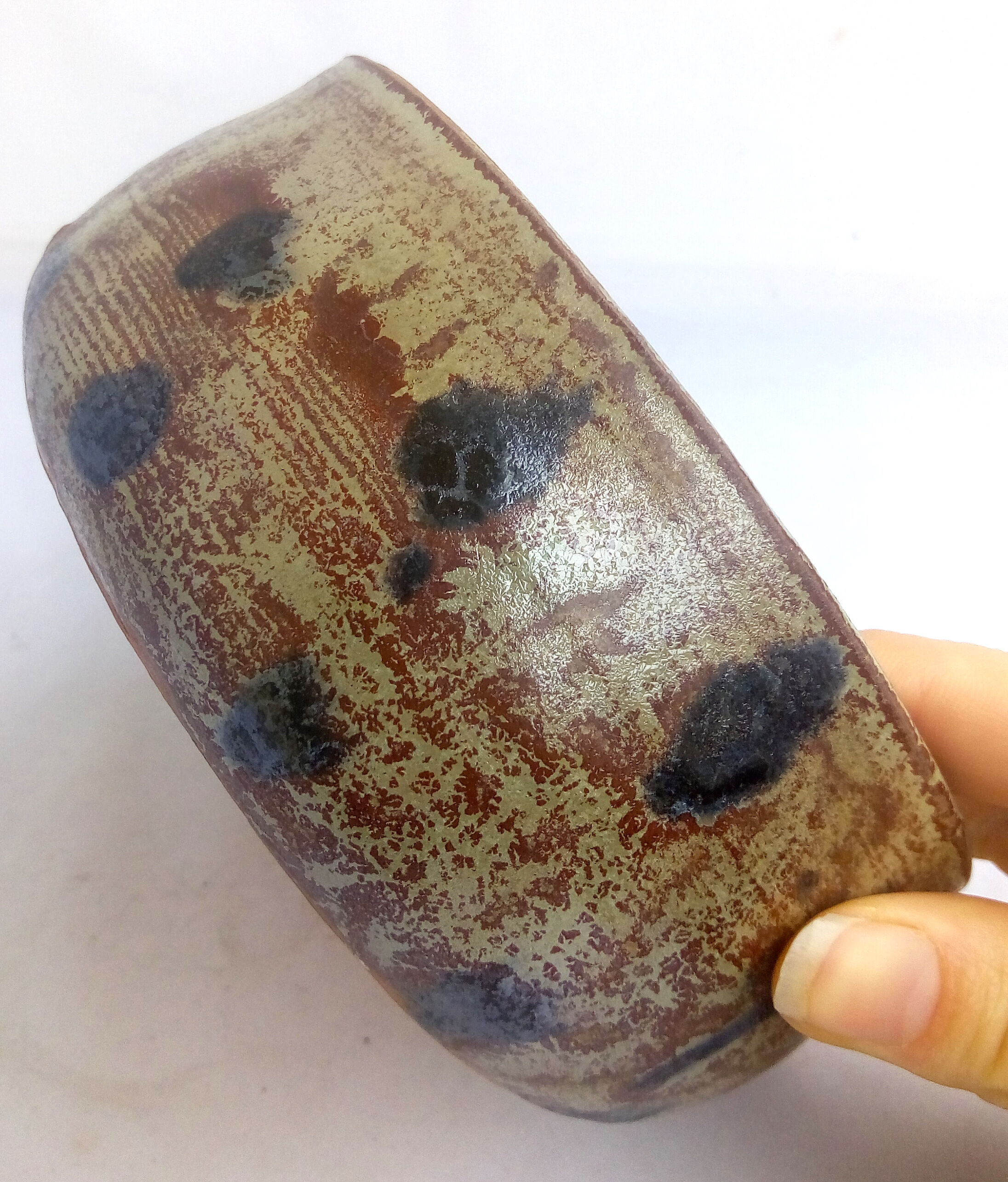Rustic blue-spotted sandstone bowl