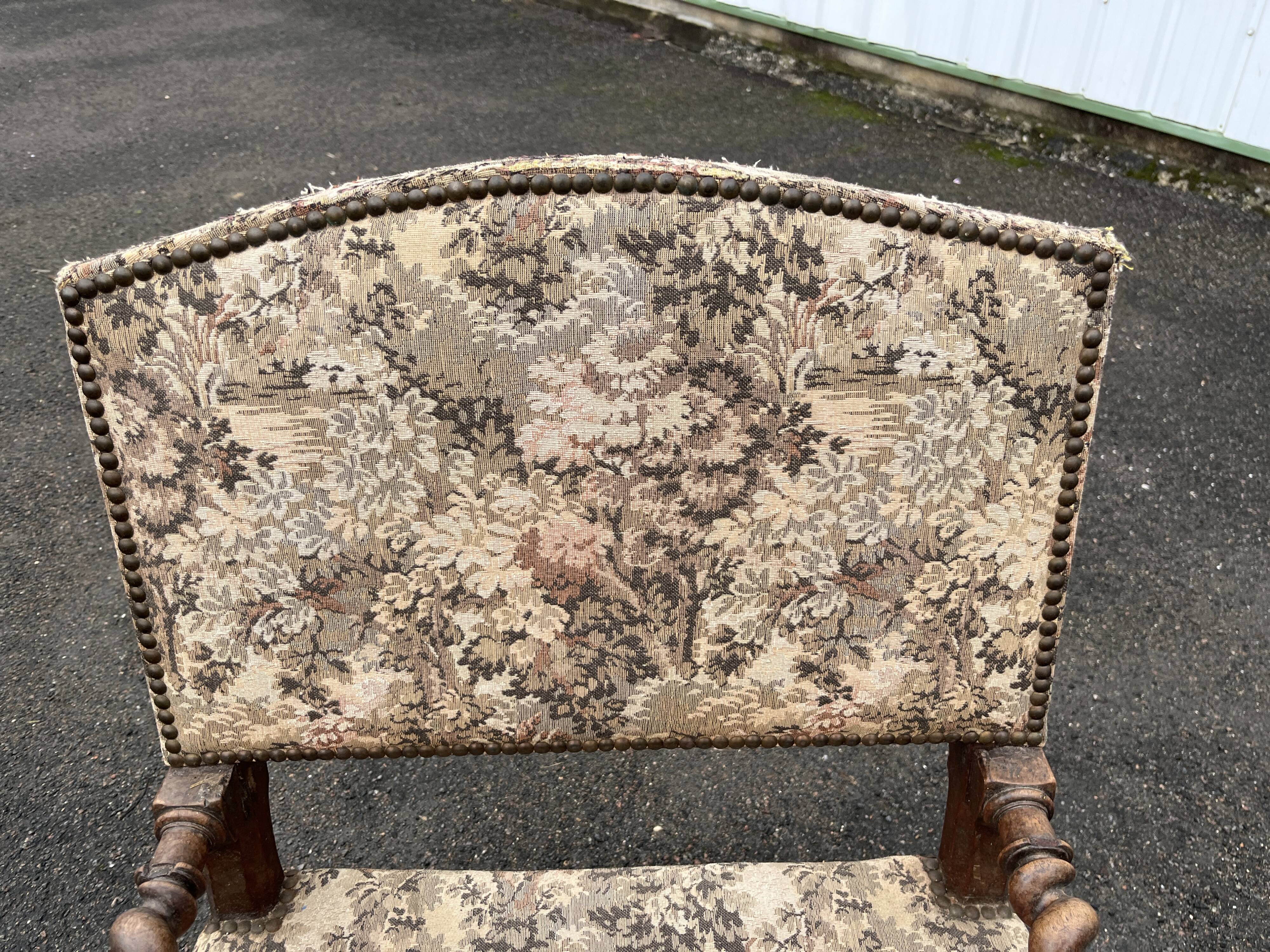 Louis XIII style armchair with twisted backrest and legs.