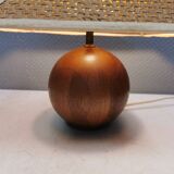 Very rare table lamp in turned teak wood with original braided shade. 1970s