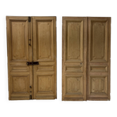 Pair of Haussmann-style double passage doors in patinated oak from the 19th century.