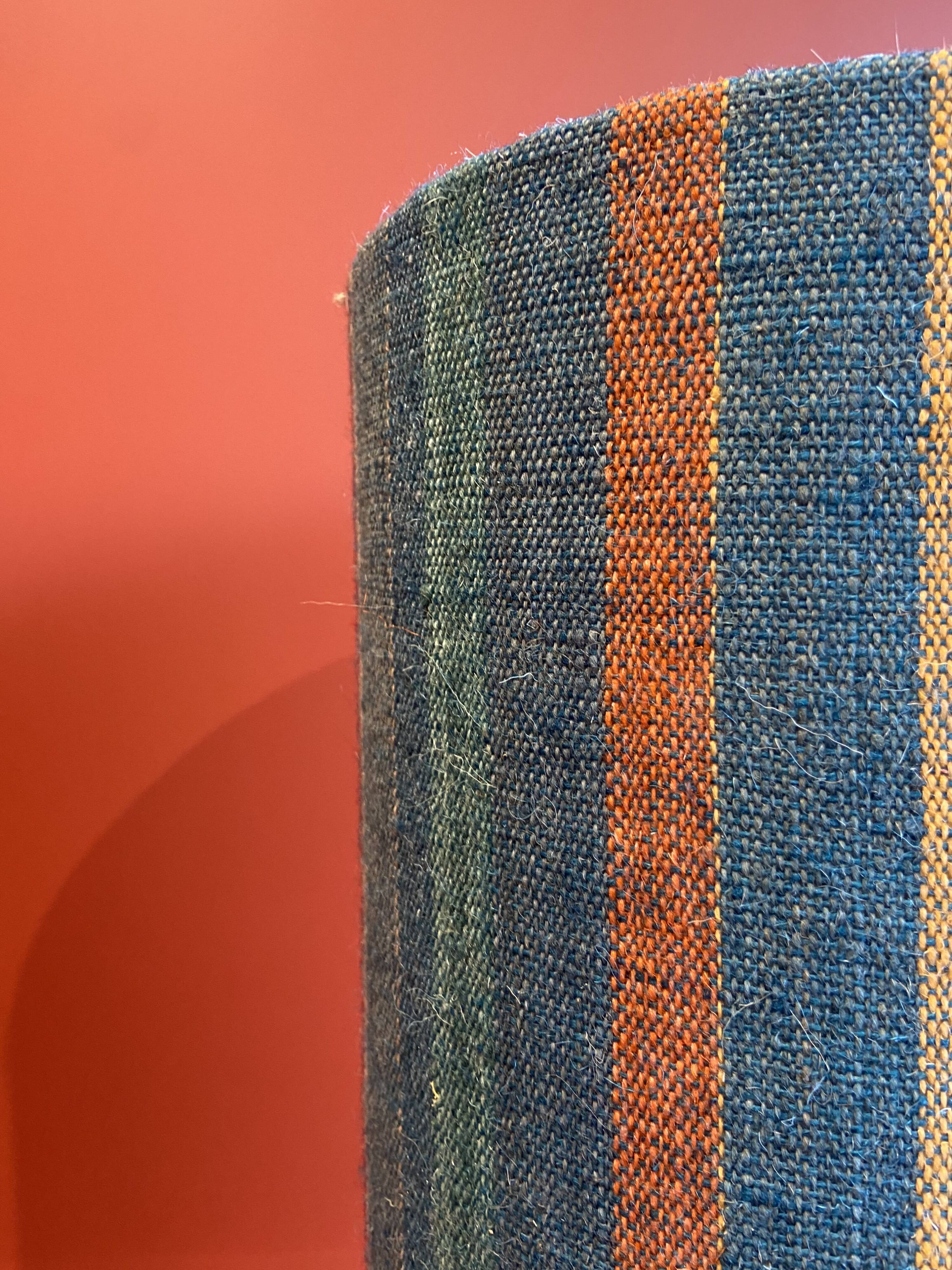 "Stoneware Bottle Lamp" with a multicoloured blue lampshade handwoven in India.