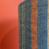 "Stoneware Bottle Lamp" with a multicoloured blue lampshade handwoven in India.