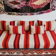 Set of covers for cream and red Moroccan floor sofa.
