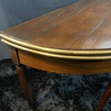 A Louis XVI period mahogany half-moon table forming a console/games table