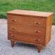Vintage chest of drawers in golden oak from the 50s with 3 drawers and spindle-legged shelf