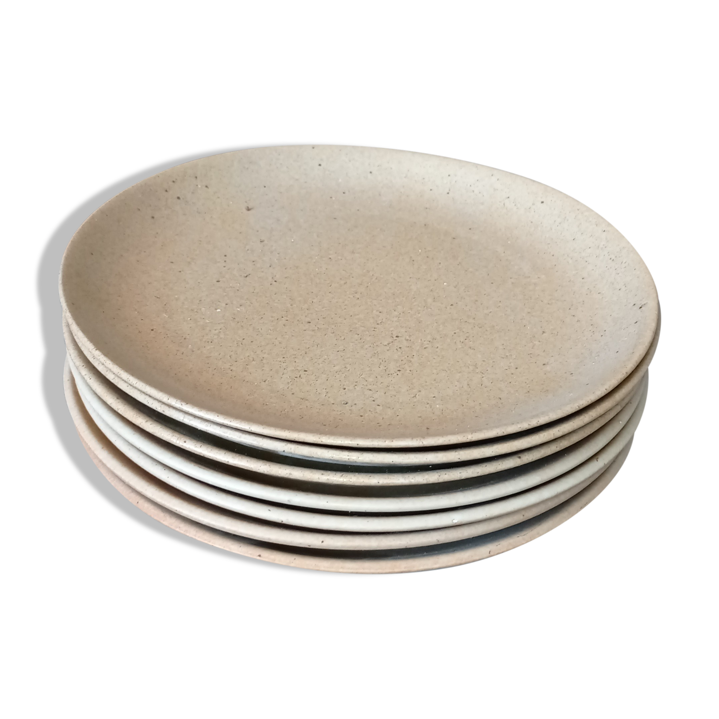 Set of seven plates in sandstone