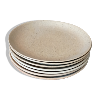 Set of seven plates in sandstone