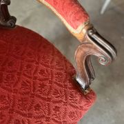 Napoleon III medallion armchair in carved wood and red velvet.